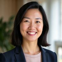 Portrait of Dr. Sarah Chen, a warm and professional Asian woman with a thoughtful expression